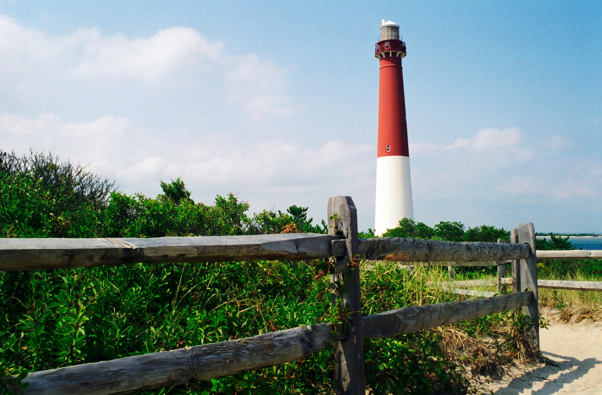 Barnegat Lighthouse on the New Jersey shore with clear blue sky